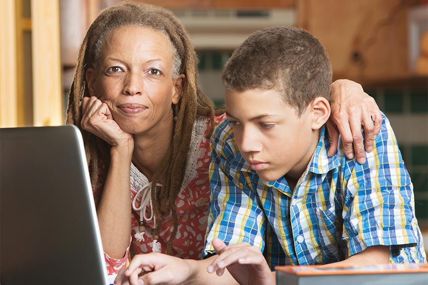 mom and son homeschooling