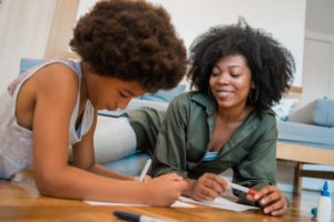 mother and daughter planning their homeschooling schedule