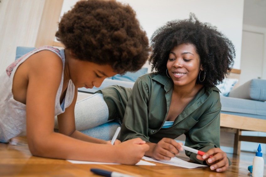 mother and daughter planning their homeschooling schedule