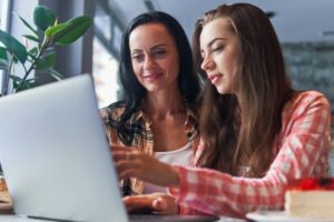 mother and daughter working on college budget