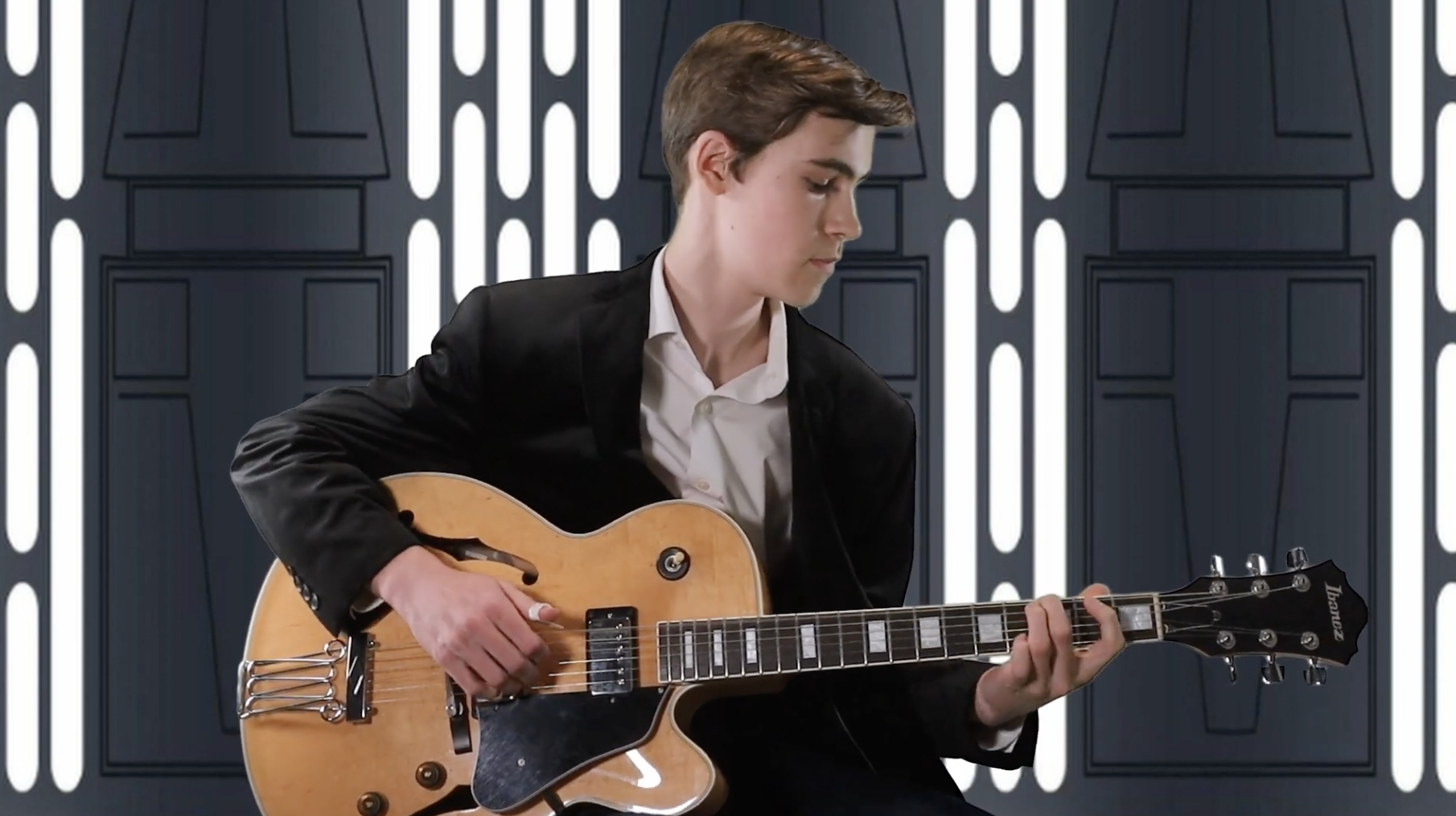 During the WTMA Talent Show 2023, Lawrence Wunderlich played his guitar with a star wars themed background.