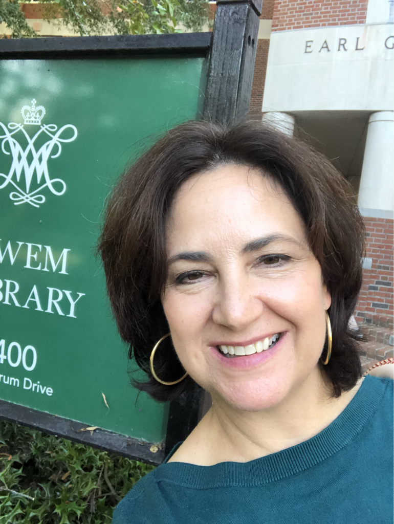 Dean Carrie Cooper of William and Mary University Libraries stands in front of an academic sign on campus. She shared insights from her career journey with WTMA students.