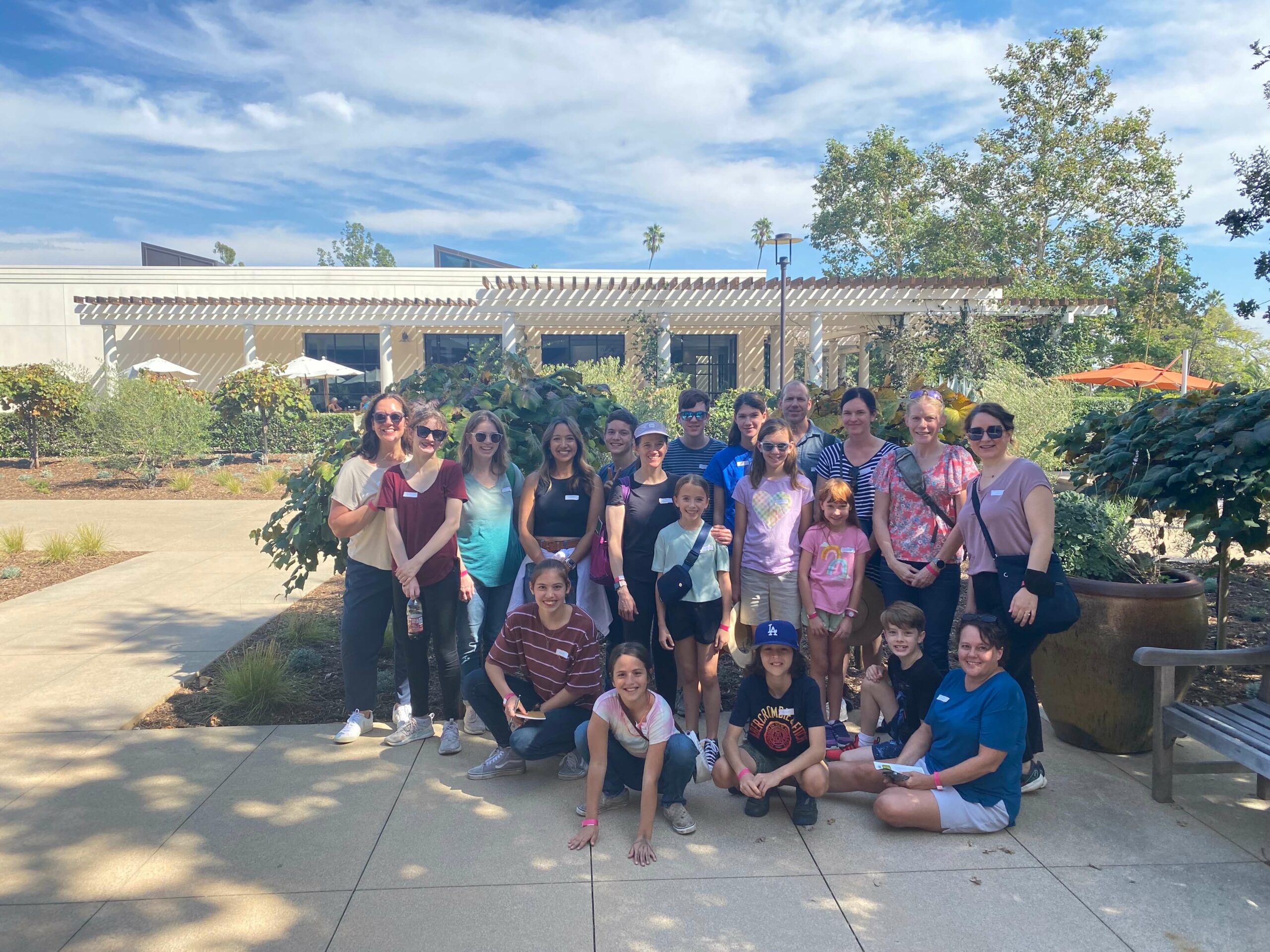 WTMA LA Community stand for a photo in front of The Huntington in Los Angeles.